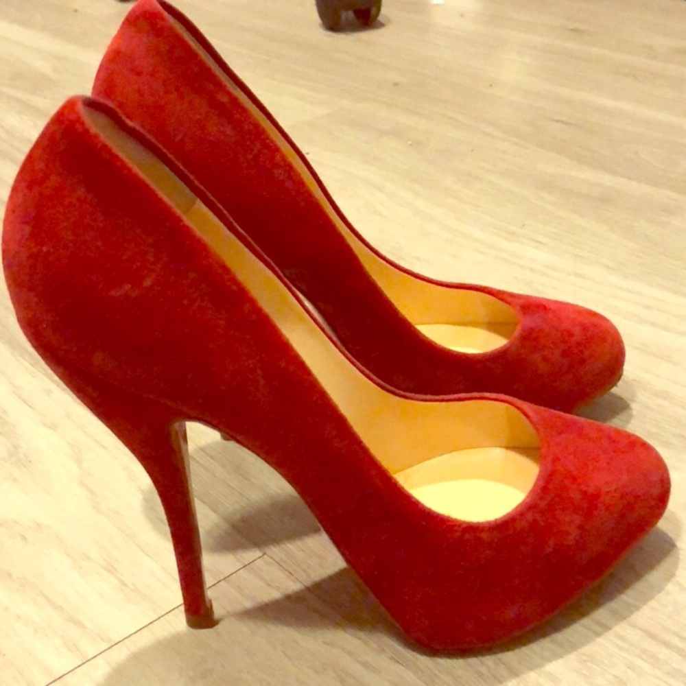 Christian Louboutin red pumps